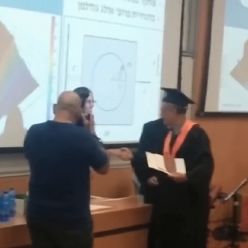 My father receiving my diploma in the graduation ceremony at the Technion.